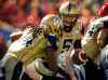Jeff McIntosh / The Canadian Press 
Winnipeg Blue Bombers quarterback Drew Willy, right, hands the ball off to Paris Cotton during first quarter CFL football action against the Calgary Stampeders in Calgary, Saturday.