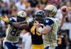 Aaron Lynett / The Canadian Press
Winnipeg Blue Bombers' quarterback Buck Pierce makes a pass as teammate Terrence Edwards holds off Hamilton Tiger-Cats' Eric Norwood in Guelph, Ont., Saturday.