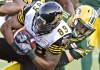 Jason Franson / The Canadian Press
Donovan Alexander (right) tackles Hamilton Tiger-Cats' Onrea Jones: the ex-Eskimo had seven interceptions in 51 games.