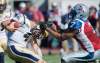 Graham Hughes /  THE CANADIAN PRESS
Winnipeg Blue Bombers' quarterback Buck Pierce is tackled by Montreal Alouettes' John Bowman during second half CFL football action in Montreal, Sunday.