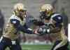 Graham Hughes / THE CANADIAN PRESS
Winnipeg Blue Bombers' quarterback Max Hall, left, hands off to Will Ford during first half CFL football action against the Montreal Alouettes in Montreal, Monda.