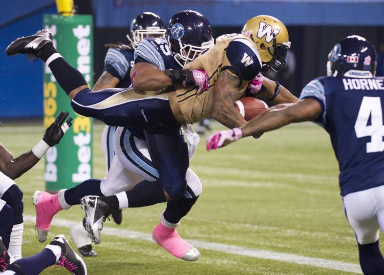 Nathan Denette / The Canadian Press Archives
Winnipeg Blue Bombers running back Chad Simpson, centre, may get another chance to shine in the Bombers' running game when they face Hamilton on Saturday