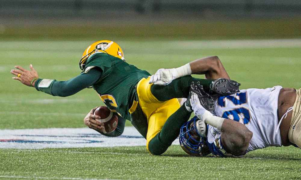 AMBER BRACKEN / THE CANADIAN PRESS
Winnipeg Blue Bombers' Drake Nevis (92) sacks Edmonton Eskimos quarterback Mike Reilly (13) during second half CFL action in Edmonton, Alta., on Saturday September 29, 2018.