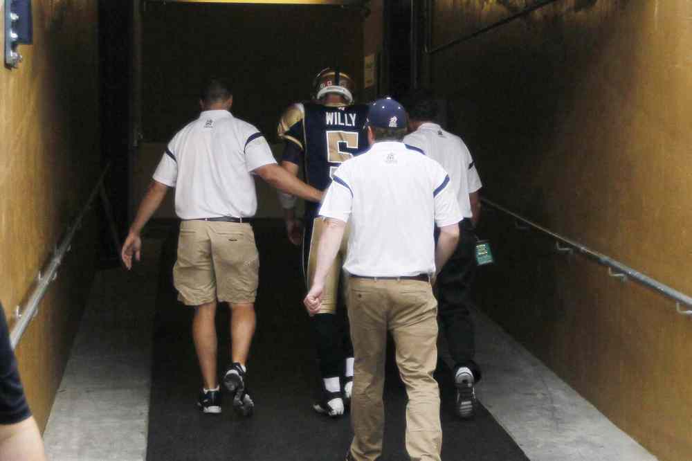 John Woods / The Canadian Press
Winnipeg Blue Bombers quarterback Drew Willy (5) enters the tunnel after being injured during a sack by the Hamilton Tiger-Cats in first half of CFL action in Winnipeg on July 2, 2015.