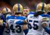 THE CANADIAN PRESS
Winnipeg Blue Bombers head coach Mike O'Shea, back, speaks with players before a pre-season CFL football game against the B.C. Lions, in Vancouver, on Friday June 8, 2018. THE CANADIAN PRESS/Darryl Dyck