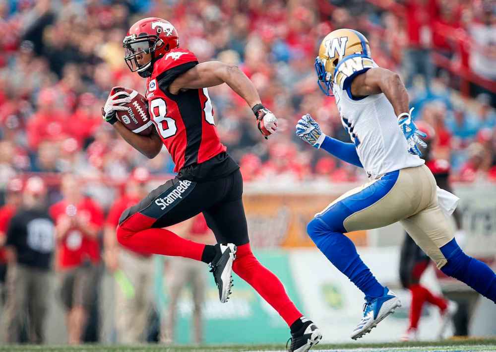 JEFF MCINTOSH / THE CANADIAN PRESS
Winnipeg Blue Bombers' Maurice Leggett, right, chases Calgary Stampeders' Kamar Jorden during second half CFL football action in Calgary, Saturday, Aug. 25, 2018.