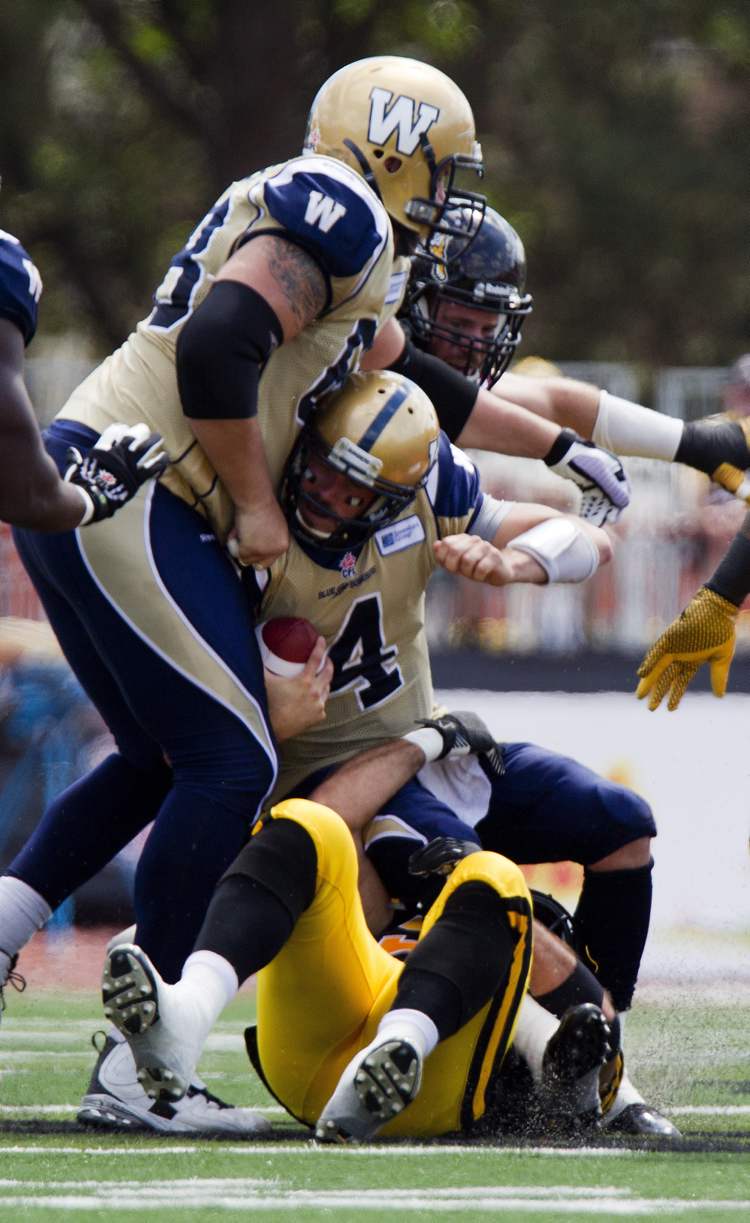 CP
Below, Pierce is sacked by Hamilton Tiger-Cats' Hasan Hazime during the first quarter against the Hamilton Tiger-Cats last weekend.