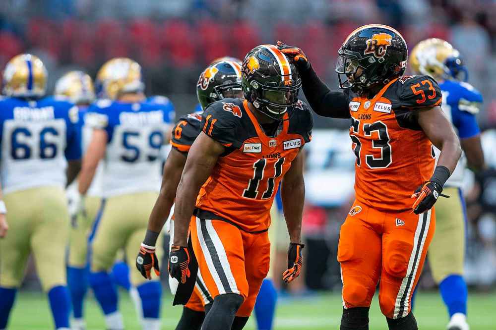 BEN NELMS / THE CANADIAN PRESS
BC Lions defensive end Odell Willis (11) celebrates a tackle against the Winnipeg Blue Bombers with teammate Jordan Herdman-Reed (53) during the first half.