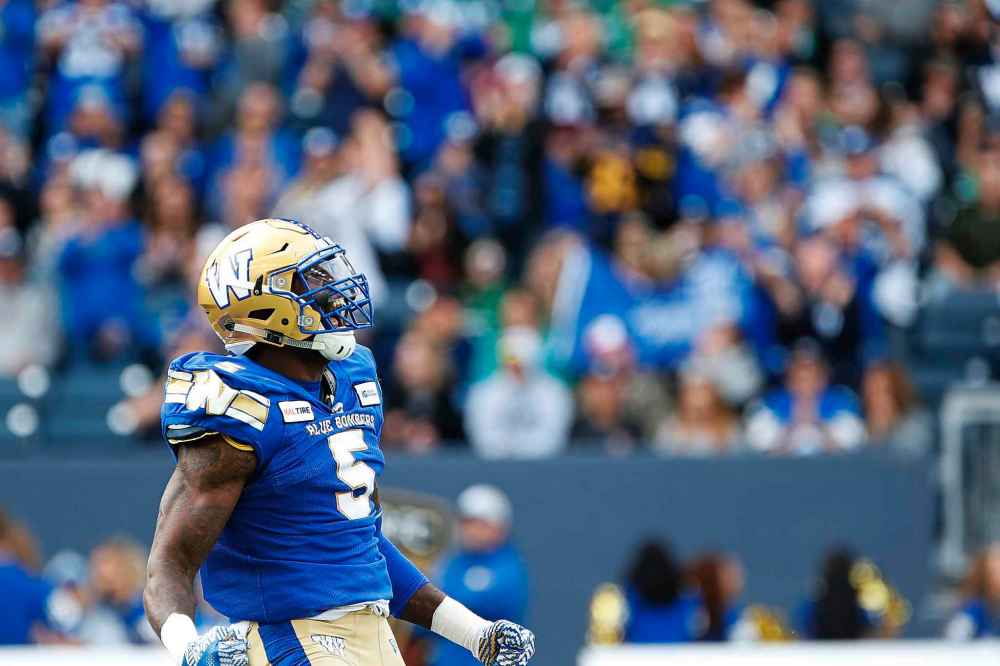 JOHN WOODS / THE CANADIAN PRESS
Winnipeg Blue Bombers' Willie Jefferson (5) celebrates a sack on Saskatchewan Roughriders quarterback Cody Fajardo (7) during the first half of CFL action in Winnipeg Saturday, September 7, 2019.