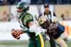 CP
Edmonton Eskimos' quarterback Mike Reilly (13) gets away from Winnipeg Blue Bombers' Demond Washington (7) during the second half of CFL action in Winnipeg 
THE CANADIAN PRESS/John Woods