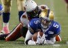 John Woods / The Canadian Press
Winnipeg Blue Bombers quarterback Drew Willy (5) gets tackled by BC Lions' Jabar Westerman (99) on the 10 yard line in Winnipeg Saturday.