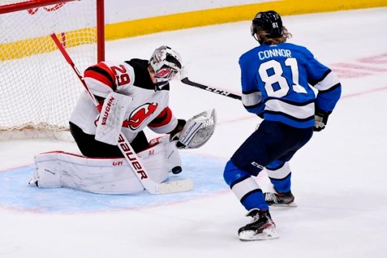 New Jersey DevilsÕ goaltender Mackenzie Blackwood (29) makes a save on Winnipeg Jets' Kyle Connor (81) during shoot-out during NHL action in Winnipeg on Tuesday, Nov. 5, 2019. THE CANADIAN PRESS/Fred Greenslade