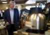 ADRIAN WYLD / THE CANADIAN PRESS
Conservative leader Stephen Harper walks behind the counter to serve coffee to supporters as he stops at a Tim Hortons in Gananoque, Ont., on Monday.