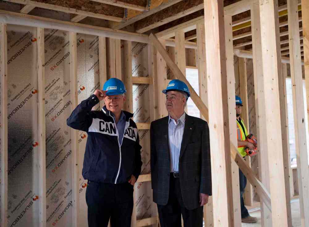 NATHAN DENETTE / THE CANADIAN PRESS
Conservative Leader Stephen Harper (left) and candidate Julian Fantino look over a home-construction site while making a campaign stop in Kleinburg, Ont.
