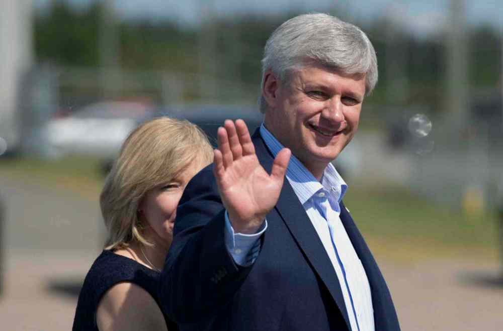Adrian Wyld / The Canadian Press
Conservative leader Stephen Harper waves as he walks with his wife Laureen to the campaign plane in Trois Rivieres, Que., on Friday, Sept. 11.