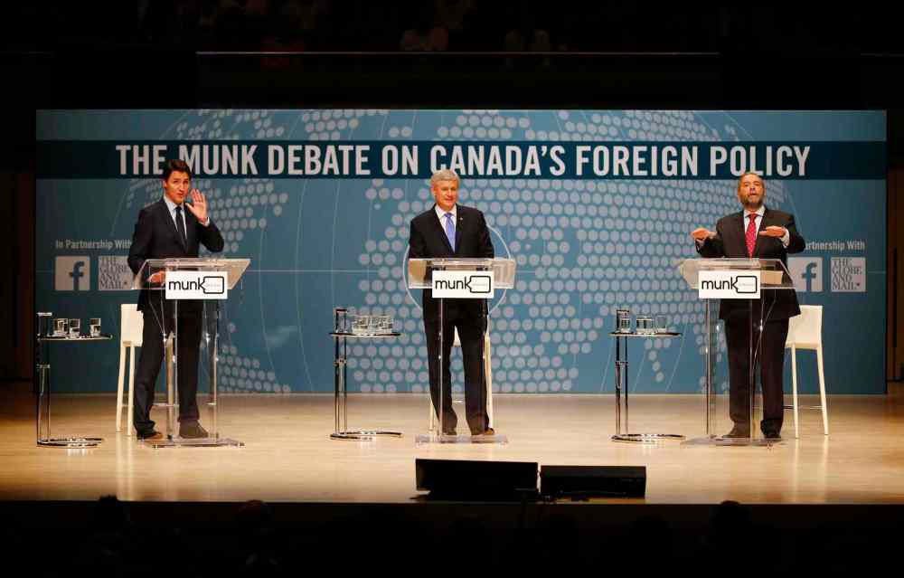 MARK BLINCH / THE CANADIAN PRESS
Liberal Leader Justin Trudeau (from left), Conservative Leader Stephen Harper and NDP Leader Tom Mulcair participate in the Munk debate on foreign policy Monday.