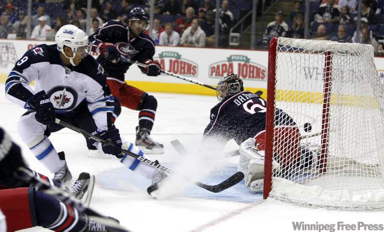 Boris Minkevich / Winnipeg Free Press
Evander Kane scores the first goal for the new-look Jets in Columbus Tuesday.