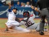 Toronto Blue Jays' Teoscar Hernandez is out at home plate as Cleveland Indians catcher Roberto Perez puts the tag on him in the eighth inning of their American League MLB baseball game in Toronto Tuesday July 23, 2019. THE CANADIAN PRESS/Fred Thornhill
