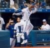 Toronto Blue Jays' Randall Grichuk and Vladimir Guerrero Jr. celebrate after hitting back to back home runs against the Seattle Mariners in the third inning of their American League MLB baseball game in Toronto Friday August 16, 2019. THE CANADIAN PRESS/Fred Thornhill