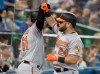 Baltimore Orioles DJ Stewart, right, is greeted by teammate Austin Wynns after Stewart hit a two-run home run against the Toronto Blue Jays in the sixth inning of their American League MLB baseball game in Toronto on Tuesday, September 24, 2019. THE CANADIAN PRESS/Fred Thornhill
