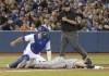 Tampa Bay Rays' Austin Meadows tumbles face down into third base after being tagged out in a run-down with Toronto Blue Jays catcher Luke Maile in the sixth inning of their American League MLB baseball game in Toronto on Saturday, April 13, 2019. THE CANADIAN PRESS/Fred Thornhill