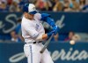 Toronto Blue Jays' Brandon Drury hits a two-run home run against the Boston Red Sox in the sixth inning of their American League MLB baseball game in Toronto, Wednesday, July 3, 2019. THE CANADIAN PRESS/Fred Thornhill