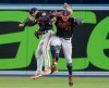Baltimore Orioles outfielders Steve Wilkerson (12), Keon Broxton and Anthony Santander (25), celebrate following their American League MLB baseball victory over the Toronto Blue Jays, in Toronto on Friday, July 5, 2019. THE CANADIAN PRESS/Fred Thornhill