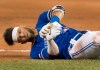 Toronto Blue Jays' Lourdes Gurriel Jr. hits the ground awkwardly at first base during ninth inning American League MLB baseball game action against the New York Yankees in Toronto Thursday August 8, 2019. THE CANADIAN PRESS/Fred Thornhill