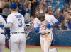 Toronto Blue Jays' Anthony Alford gets a sports drink shower as he arrives at home plate after a walk-off home run to end the 15th inning of American League MLB baseball action against the Baltimore Orioles, in Toronto, Tuesday, Sept. 24, 2019. THE CANADIAN PRESS/Fred Thornhill