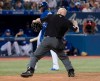 Toronto Blue Jays third baseman Vladimir Guerrero Jr. (27) argues a called third strike in the seventh inning with home plate umpire Mike Estabrook and is tossed from the American League MLB baseball game against the Houston Astros in Toronto Friday August 30, 2019. THE CANADIAN PRESS/Fred Thornhill