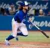 Toronto Blue Jays' Bo Bichette hits a double against the New York Yankees during the sixth inning of their American League MLB baseball game in Toronto Thursday August 8, 2019. THE CANADIAN PRESS/Fred Thornhill