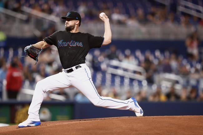 Miami Marlins starting pitcher Caleb Smith delivers during the first inning of the team's baseball game against the Atlanta Braves on Friday, Aug. 9, 2019, in Miami. (AP Photo/Brynn Anderson)