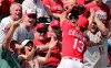 Fans react to St. Louis Cardinals third baseman Matt Carpenter (13) catching a fly ball headed for the stands in the fifth inning during an exhibition spring training baseball game against the Washington Nationals on Monday, March 11, 2019, in Jupiter, Fla. (AP Photo/Brynn Anderson)