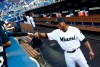 Miami Marlins left fielder Curtis Granderson laughs with a young fan before a baseball game against the Chicago Cubs, Monday, April 15, 2019, in Miami. (AP Photo/Brynn Anderson)