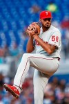 Philadelphia Phillies starting pitcher Zach Eflin winds up during the first inning of the team's baseball game against the Miami Marlins on Saturday, April 13, 2019, in Miami. (AP Photo/Brynn Anderson)