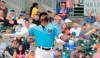 Miami Marlins' Lewis Brinson (9) looks up after hitting a foul ball in the second inning during an exhibition spring training baseball game against the New York Mets on Saturday, March 16, 2019, in Jupiter, Fla. (AP Photo/Brynn Anderson)