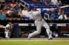 Chicago Cubs' Javier Baez (9) hits a solo home run off Miami Marlins pitcher Adam Conley during the eighth inning of a baseball game, Tuesday, April 16, 2019, in Miami. (AP Photo/Brynn Anderson)