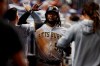 Pittsburgh Pirates' Josh Bell (55) celebrates in the dugout after scoring during the fifth inning of a baseball game against the Miami Marlins, Friday, June 14, 2019, in Miami. (AP Photo/Brynn Anderson)