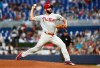 Philadelphia Phillies starting pitcher Jake Arrieta delivers during the first inning of the team's baseball game against the Miami Marlins on Friday, April 12, 2019, in Miami. (AP Photo/Brynn Anderson)