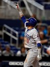 Chicago Cubs' Javier Baez celebrates as he passes home plate after he hit a solo home run during the eighth inning of the team's baseball game against the Miami Marlins on Wednesday, April 17, 2019, in Miami. (AP Photo/Brynn Anderson)