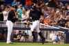 Miami Marlins' Curtis Granderson, right, is congratulated by third base coach Fredi Gonzalez (33) after hitting a solo home run during the eight inning of a baseball game against the Atlanta Braves, Saturday, Aug. 10, 2019, in Miami. (AP Photo/Brynn Anderson)