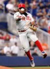 Philadelphia Phillies third baseman Maikel Franco (7) throws to first base against baserunner Miami Marlins' Harold Ramirez (47) during the fifth inning of a baseball game on Sunday, June 30, 2019, in Miami. (AP Photo/Brynn Anderson)