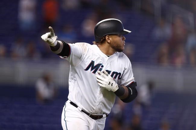 Miami Marlins' Harold Ramirez (47) hits a walk off home run during the 12th inning of a baseball game against the Minnesota Twins on Thursday, Aug. 1, 2019, in Miami. (AP Photo/Brynn Anderson)
