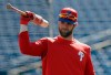 Philadelphia Phillies' Bryce Harper waits his turn in the batting cage before a spring training baseball game against the Toronto Blue Jays Saturday, March 9, 2019, in Clearwater, Fla. (AP Photo/Chris O'Meara)