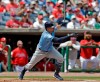 Tampa Bay Rays' Willy Adames follows the flight of his two-run single off Philadelphia Phillies pitcher Vince Velasquez during the second inning of a spring training baseball game Monday, March 11, 2019, in Clearwater, Fla. (AP Photo/Chris O'Meara)