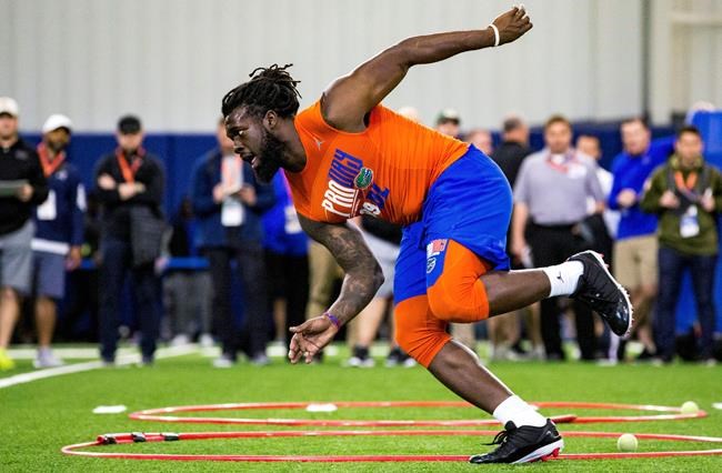 FILE - In this March 27, 2019, file photo, defensive lineman Jachai Polite runs drills during the University of Florida's football Pro Day in Gainesville, Fla. Polite is a possible pick in the 2019 NFL Draft. (Lauren Bacho/The Gainesville Sun via AP, File)