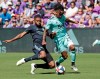 Orlando City's Ruan, left, tries to get the ball away from Vancouver Whitecaps's Yordi Reyna (29) during the first half of an MLS soccer match, Saturday, April 20, 2019, in Orlando, Fla. (AP Photo/John Raoux)