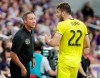 Columbus Crew's Gaston Sauro (22) has a word with coach Caleb Porter on the sideline during the first half of the team's MLS soccer match against Orlando City on Saturday, July 13, 2019, in Orlando, Fla. (AP Photo/John Raoux)