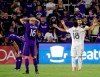 LA Galaxy's Uriel Antuna (18) celebrates with Efrain Alvarez as Orlando City's Kyle Smith, left, and Sacha Kljestan (16) react at the end of an MLS soccer match Friday, May 24, 2019, in Orlando, Fla. The Galaxy won 1-0. (AP Photo/John Raoux)