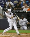 Miami Marlins' Brian Anderson hits a two-run home run off Atlanta Braves pitcher Dallas Keuchel during the fourth inning of a baseball game Thursday, Aug. 8, 2019, in Miami. (AP Photo/Luis M. Alvarez)